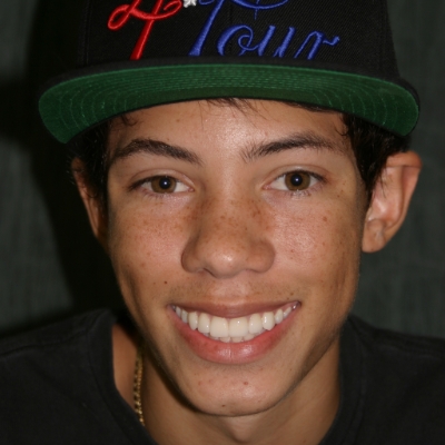 Smiling young man displaying a natural-looking smile after cosmetic dental care in the San Marcos and San Diego community