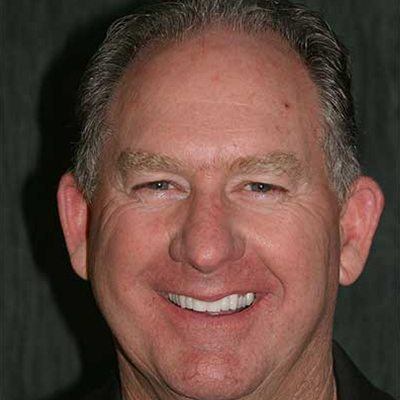 Implant dentistry for a complete and confident smile Smiling older man displaying his restored smile after implant dentistry in the San Marcos and San Diego community